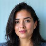 Portrait of Maya Gonzalez, lead UI/UX designer at Lumina Forge, with a thoughtful expression.